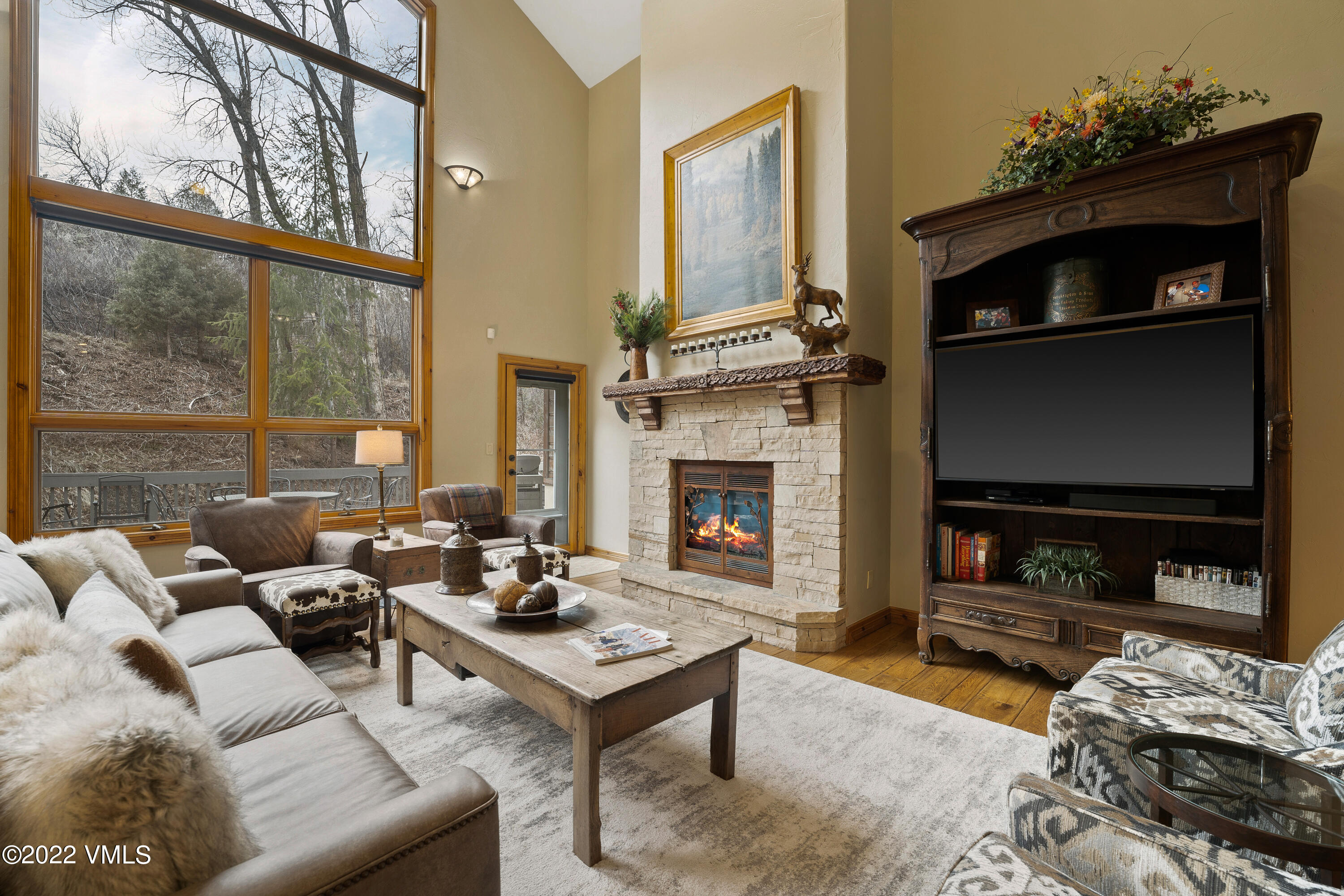 254 Arrowhead Drive, Unit B Edwards, CO 81632 - Photo 12 of 45 a living room with furniture a fireplace and a flat screen tv
