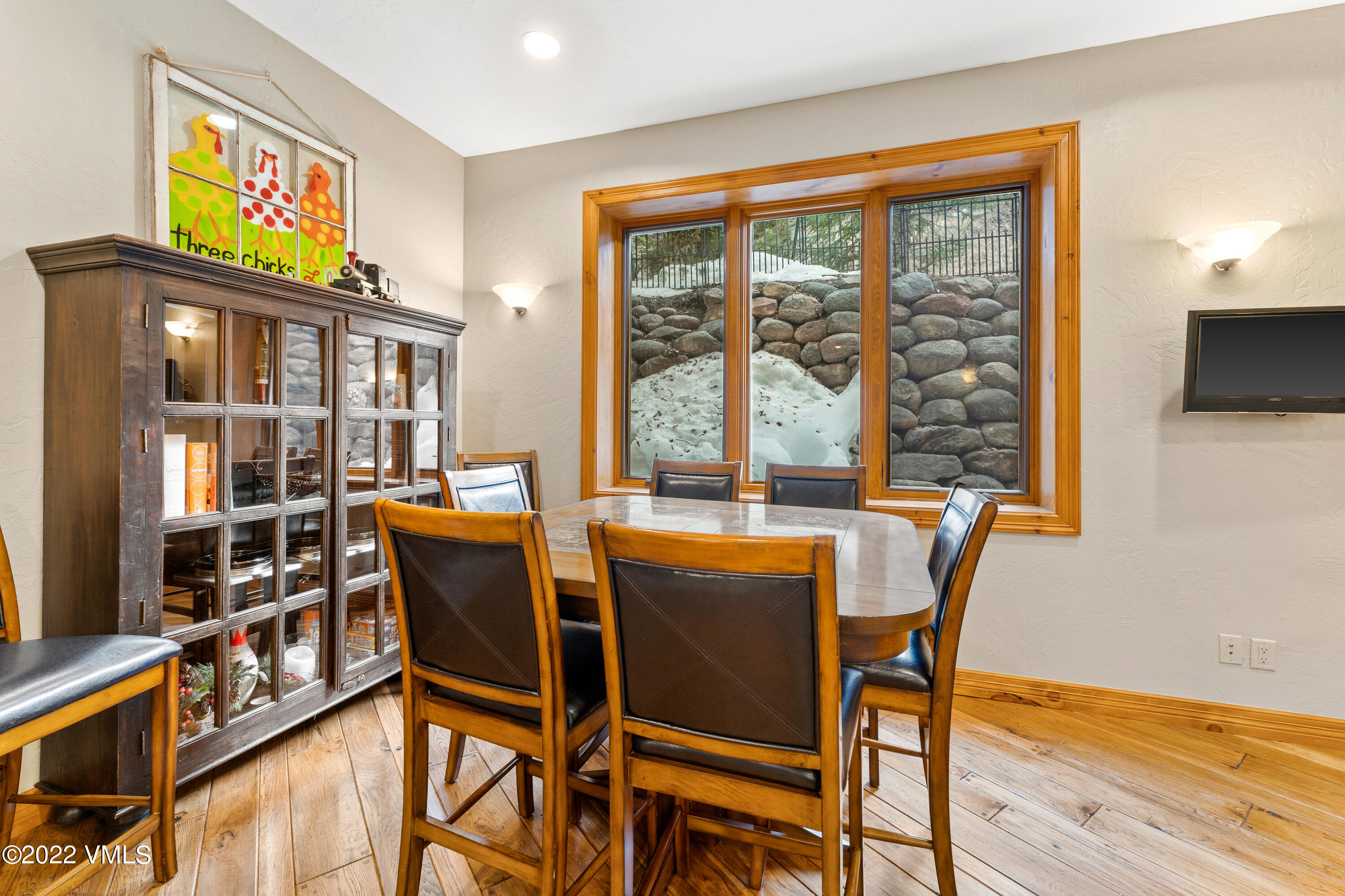 254 Arrowhead Drive, Unit B Edwards, CO 81632 - Photo 16 of 45 a dining room with furniture and a floor to ceiling window