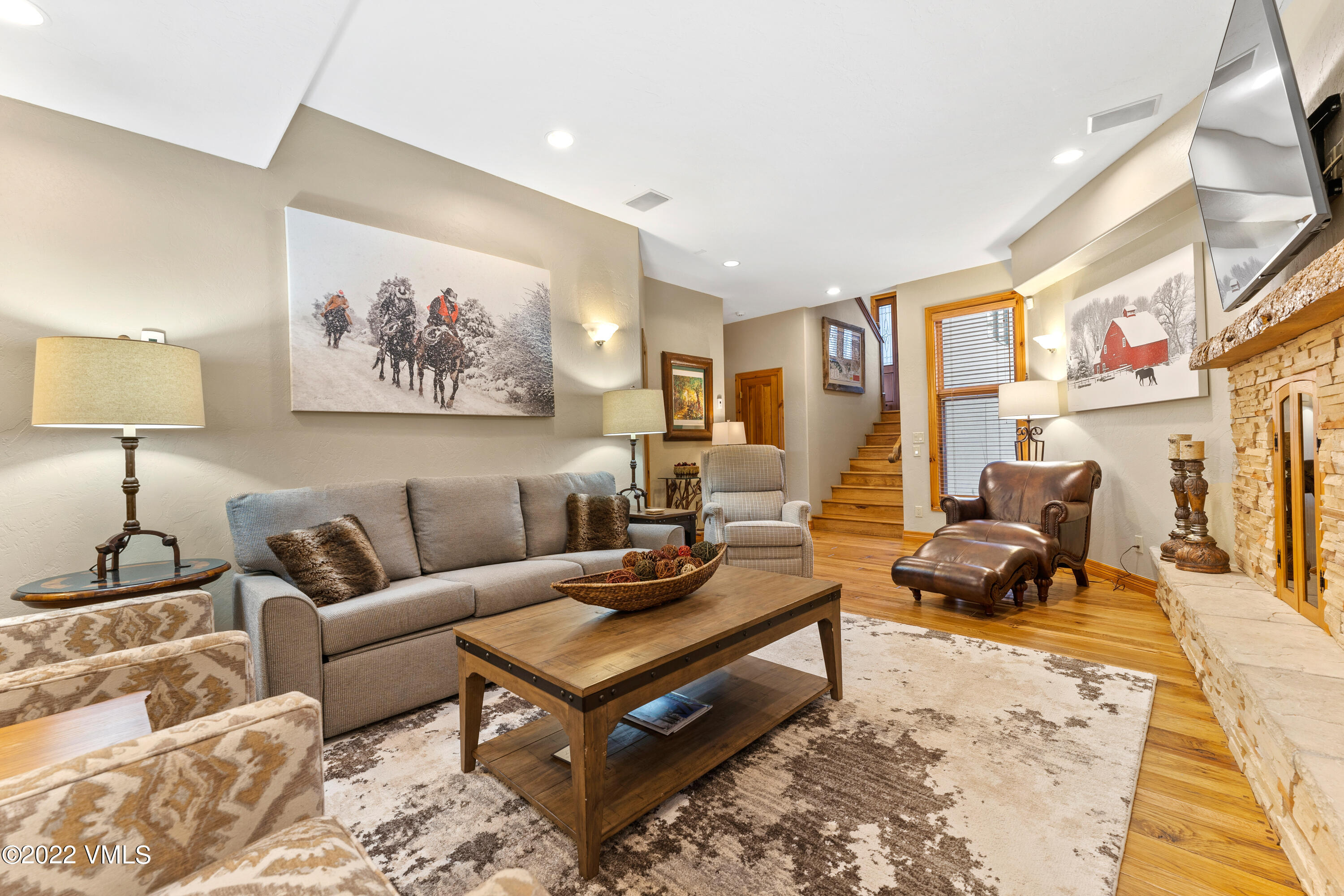 254 Arrowhead Drive, Unit B Edwards, CO 81632 - Photo 17 of 45 a living room with furniture a rug and a lamp