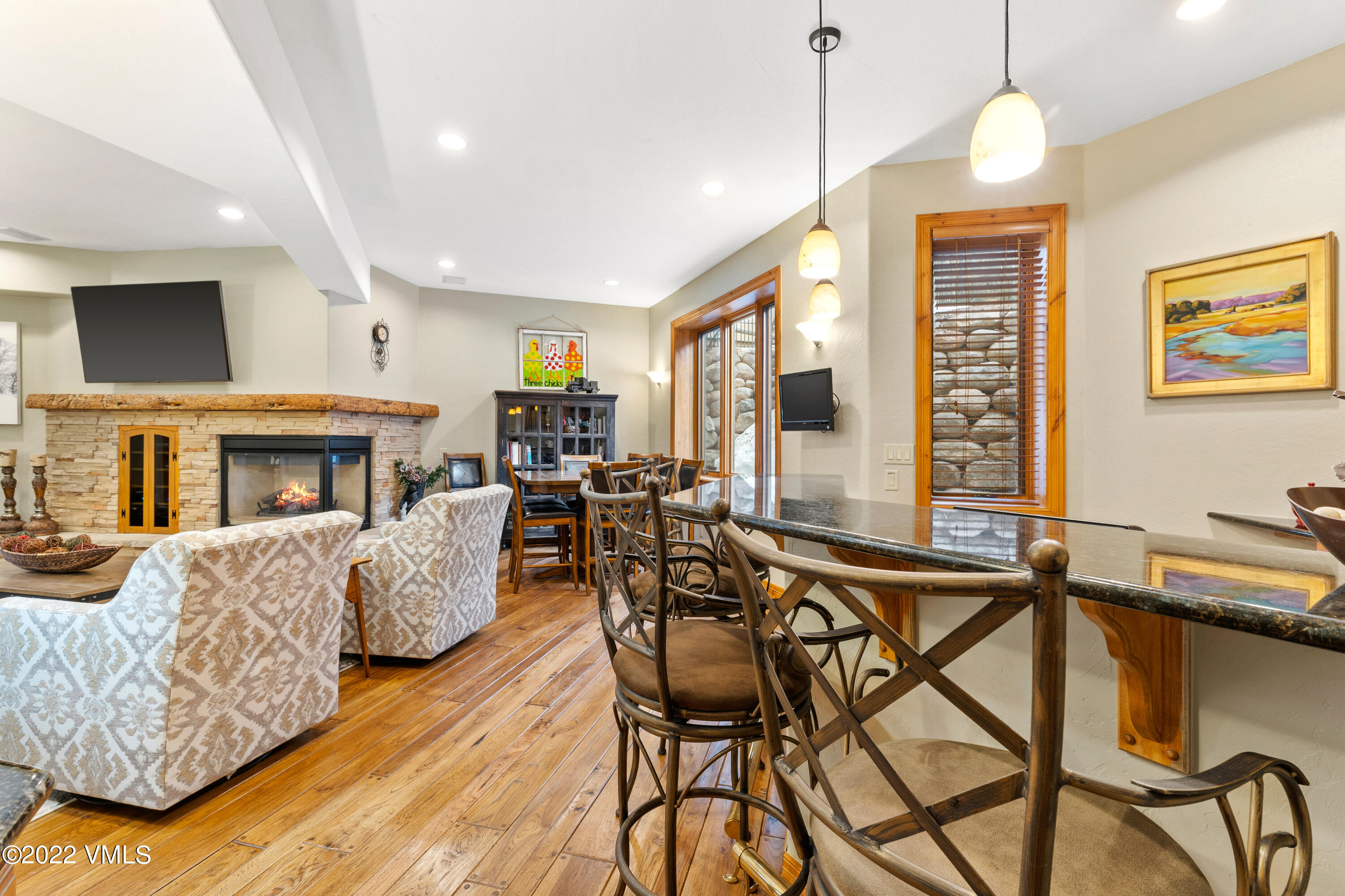 254 Arrowhead Drive, Unit B Edwards, CO 81632 - Photo 19 of 45 a living room with furniture a fireplace and a chandelier