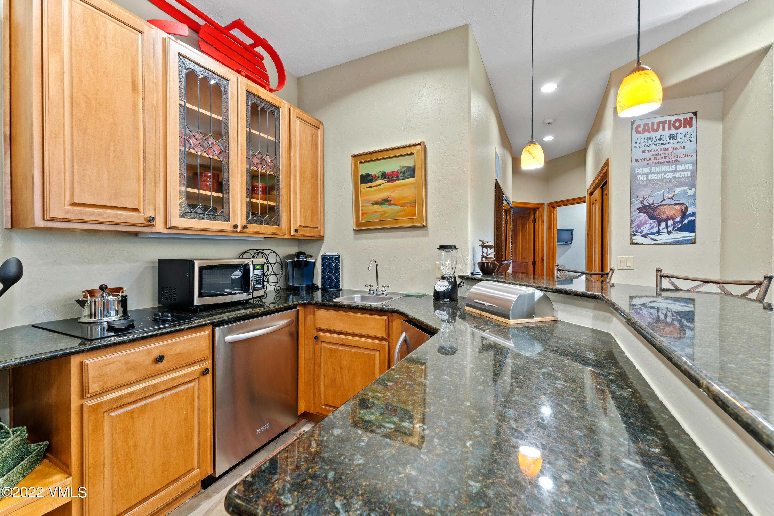 254 Arrowhead Drive, Unit B Edwards, CO 81632 - Photo 21 of 45 a large kitchen with stainless steel appliances granite countertop a sink and cabinets