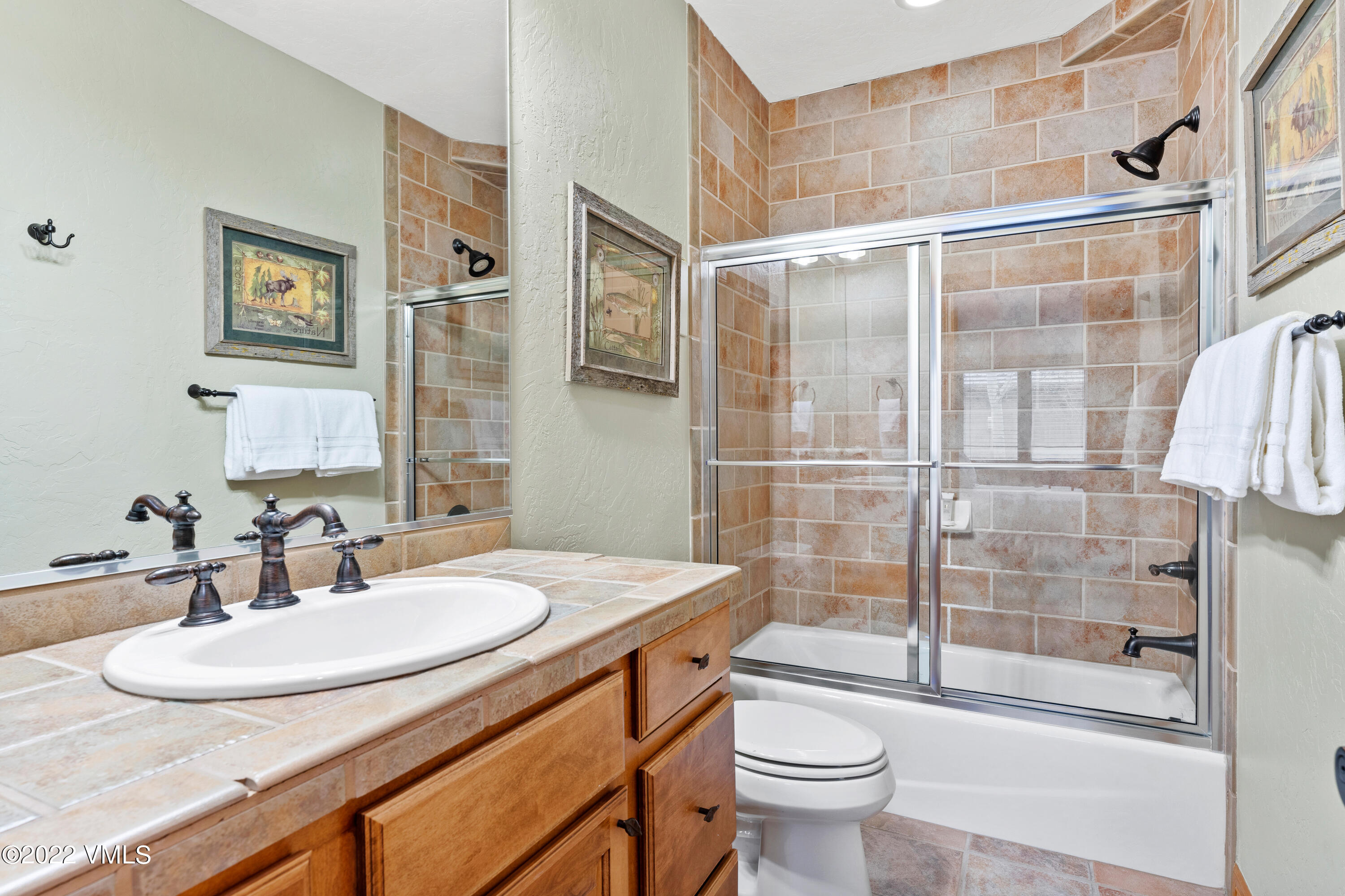254 Arrowhead Drive, Unit B Edwards, CO 81632 - Photo 24 of 45 a bathroom with a sink toilet and shower