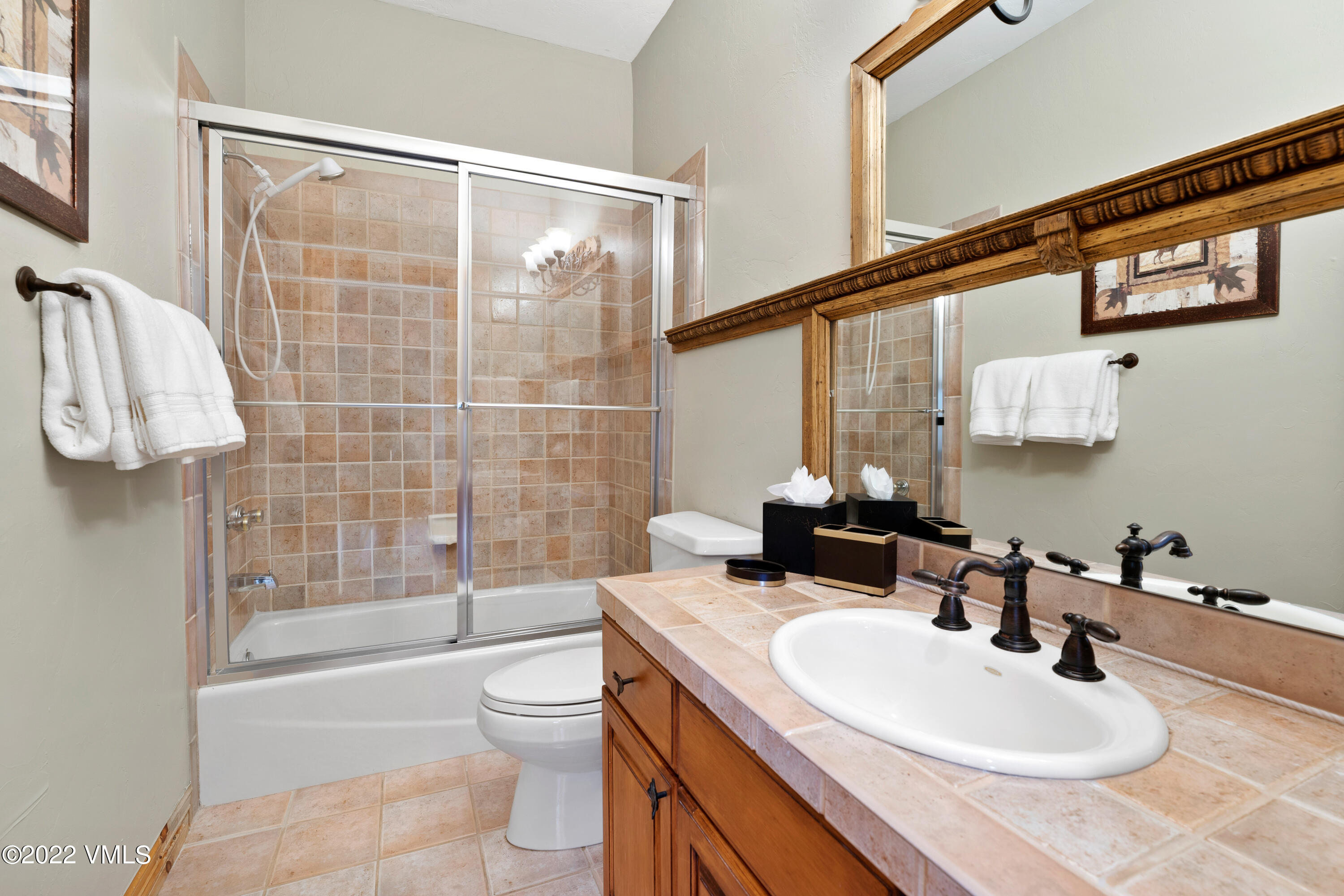 254 Arrowhead Drive, Unit B Edwards, CO 81632 - Photo 31 of 45 a bathroom with a sink toilet and shower