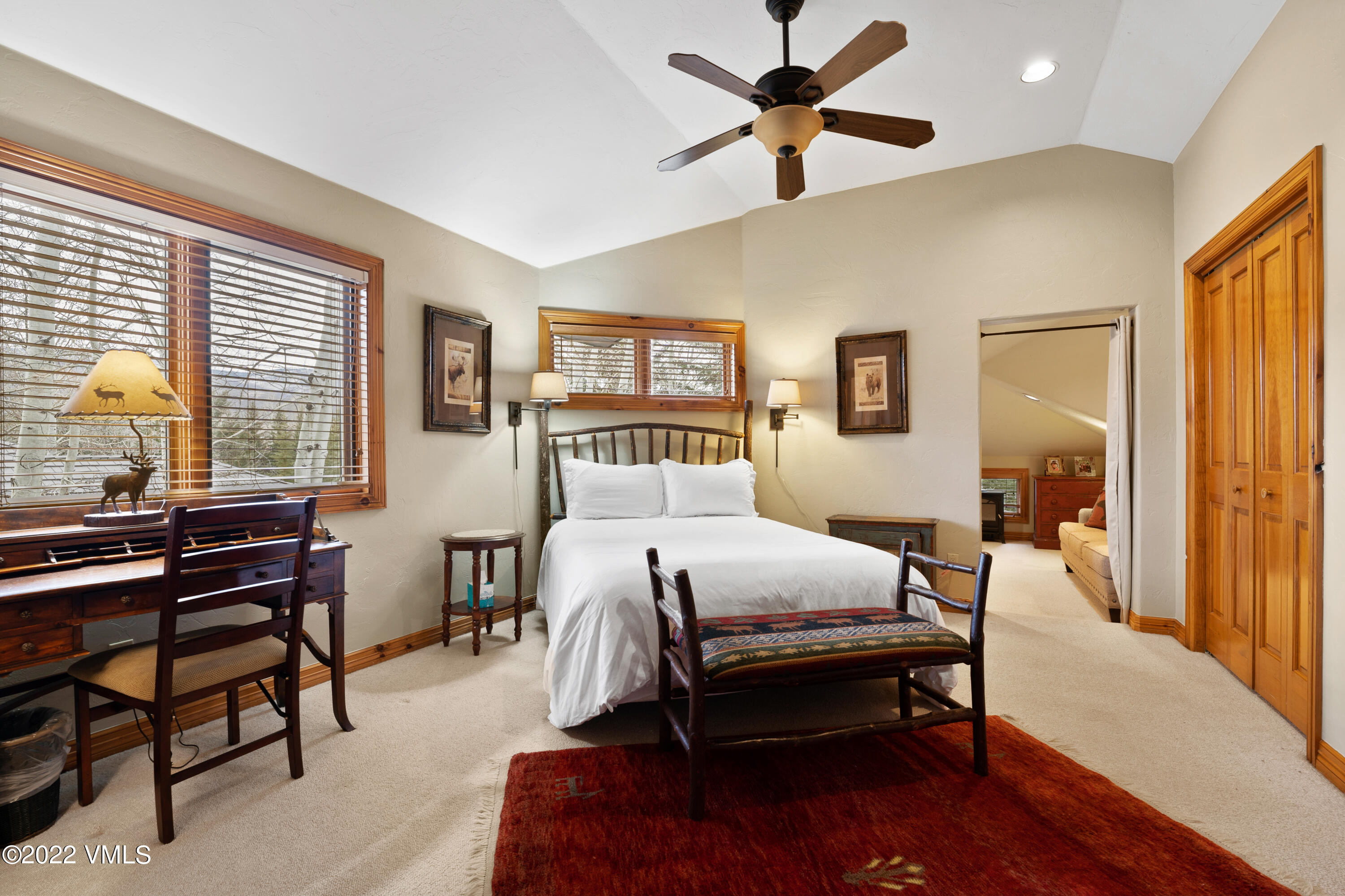 254 Arrowhead Drive, Unit B Edwards, CO 81632 - Photo 33 of 45 a bedroom with a bed and a chandelier