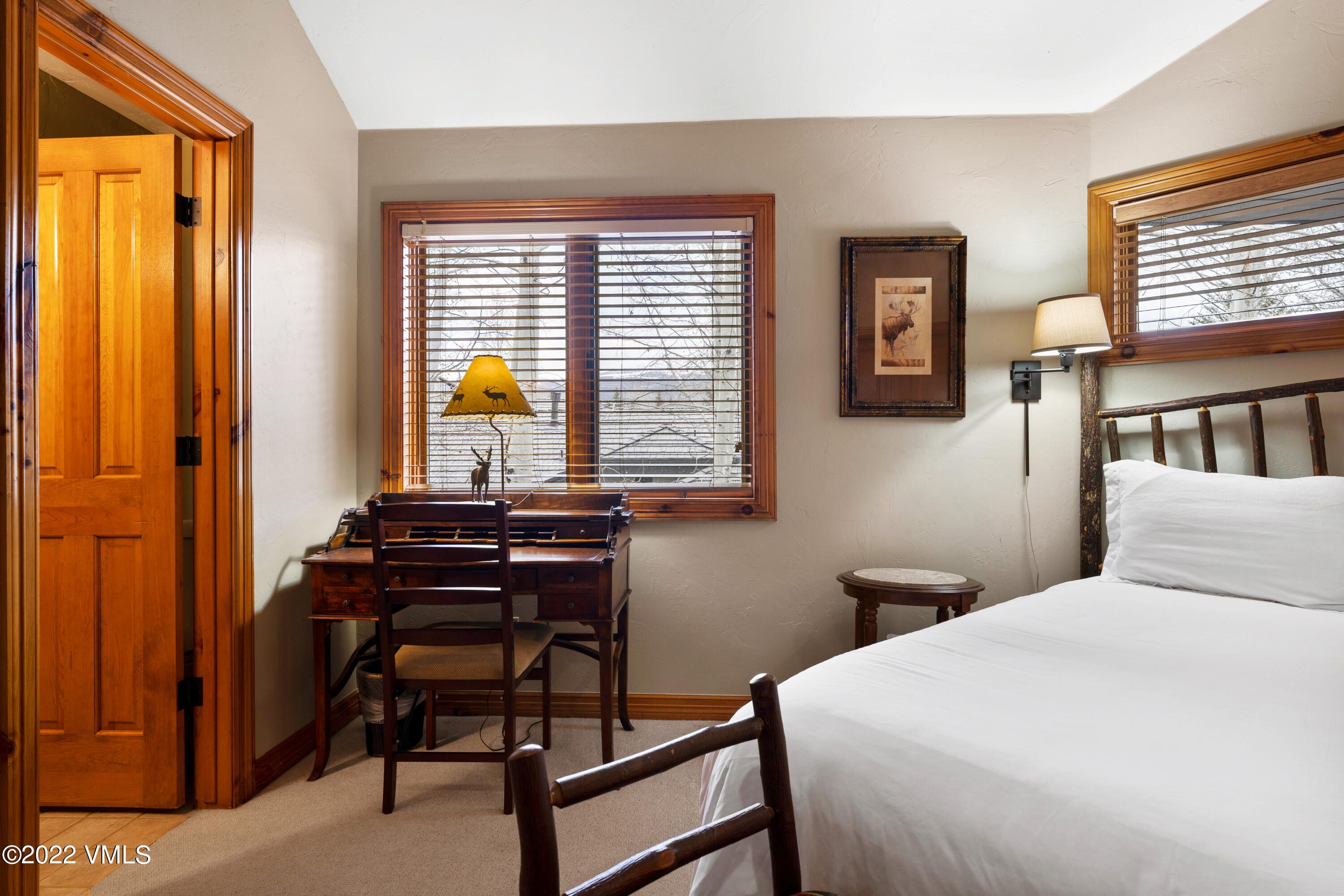 254 Arrowhead Drive, Unit B Edwards, CO 81632 - Photo 34 of 45 a bedroom with a bed and a window