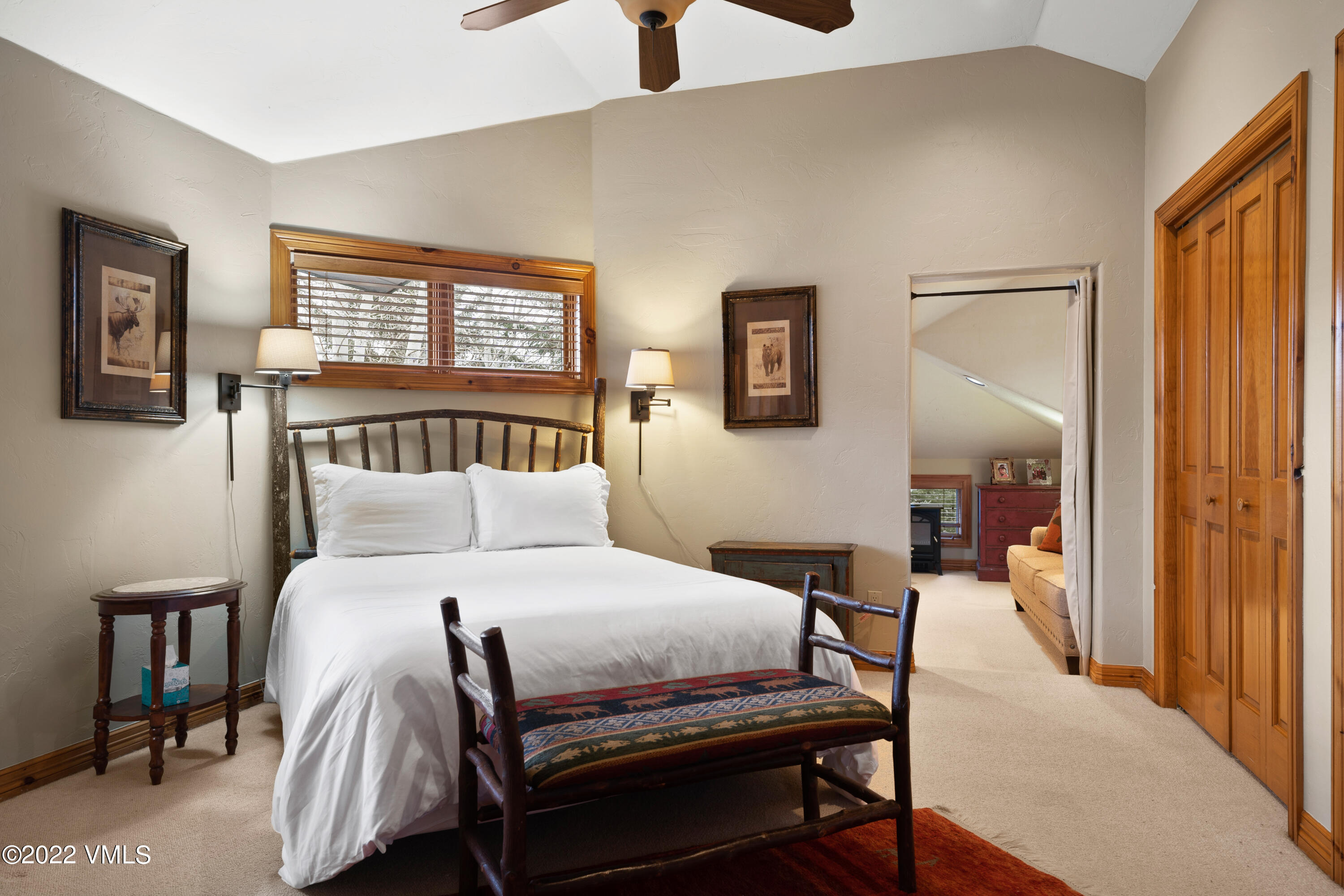 254 Arrowhead Drive, Unit B Edwards, CO 81632 - Photo 36 of 45 a bedroom with a bed and wooden floor