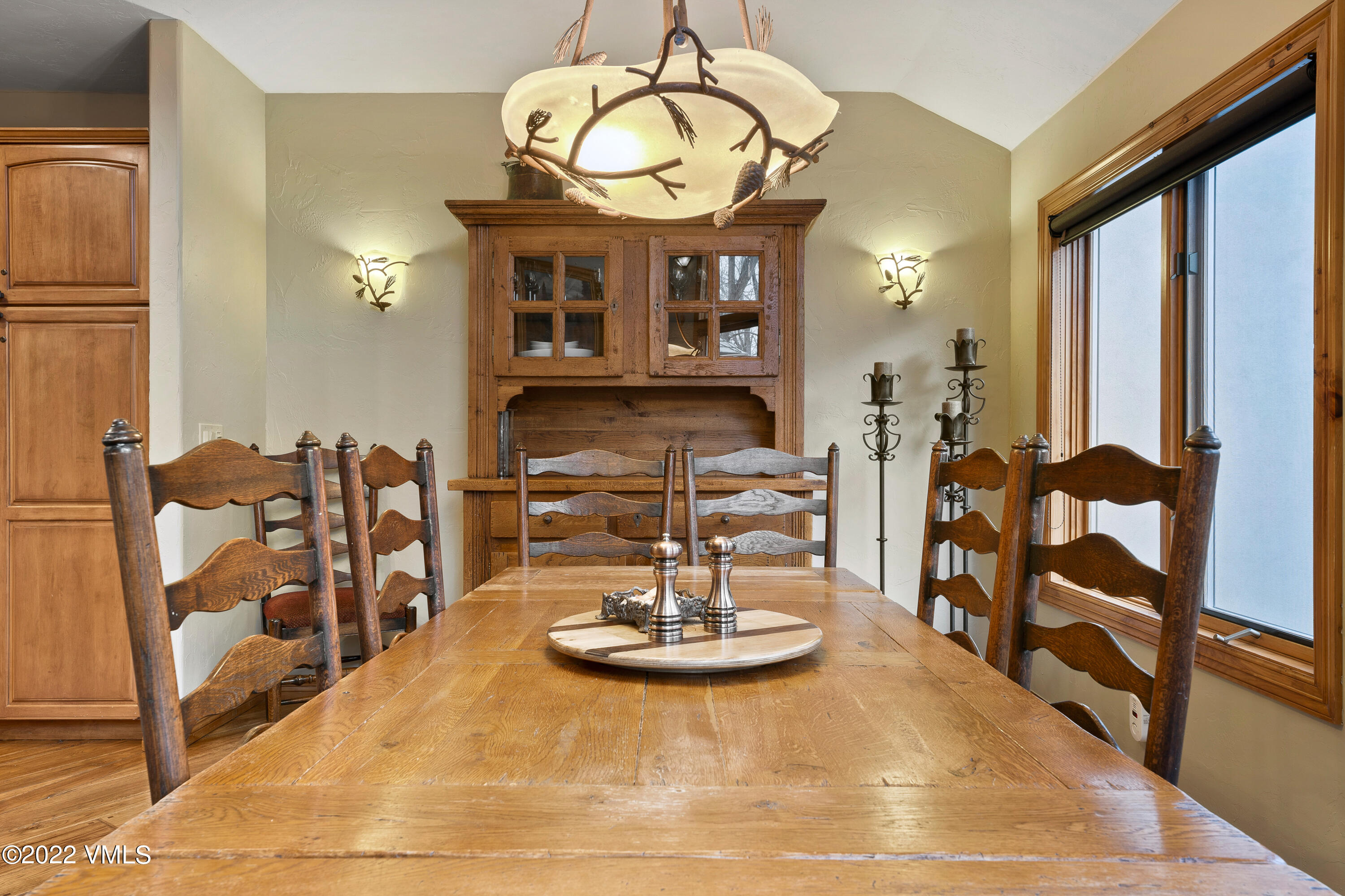 254 Arrowhead Drive, Unit B Edwards, CO 81632 - Photo 41 of 45 a view of a dining room with furniture window and wooden floor