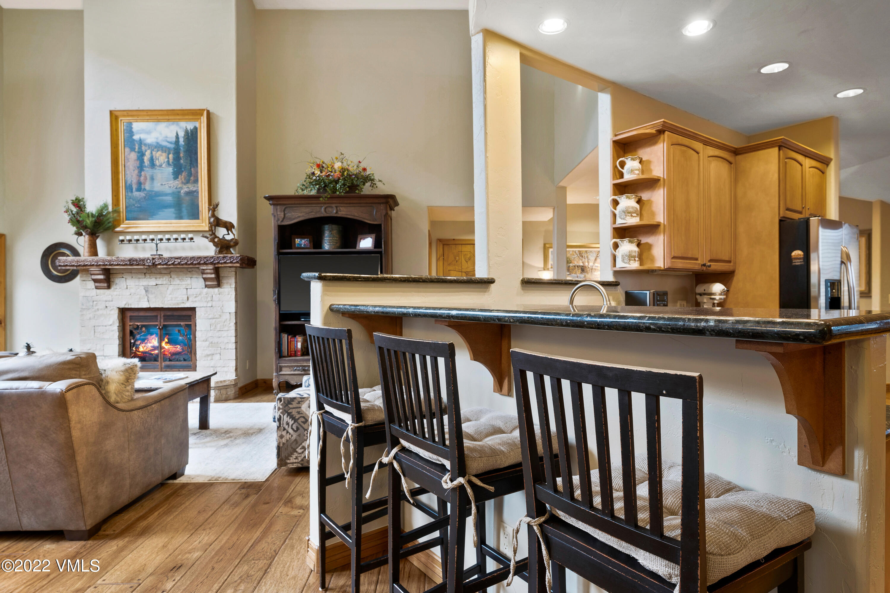254 Arrowhead Drive, Unit B Edwards, CO 81632 - Photo 42 of 45 a living room with furniture a fireplace and a table
