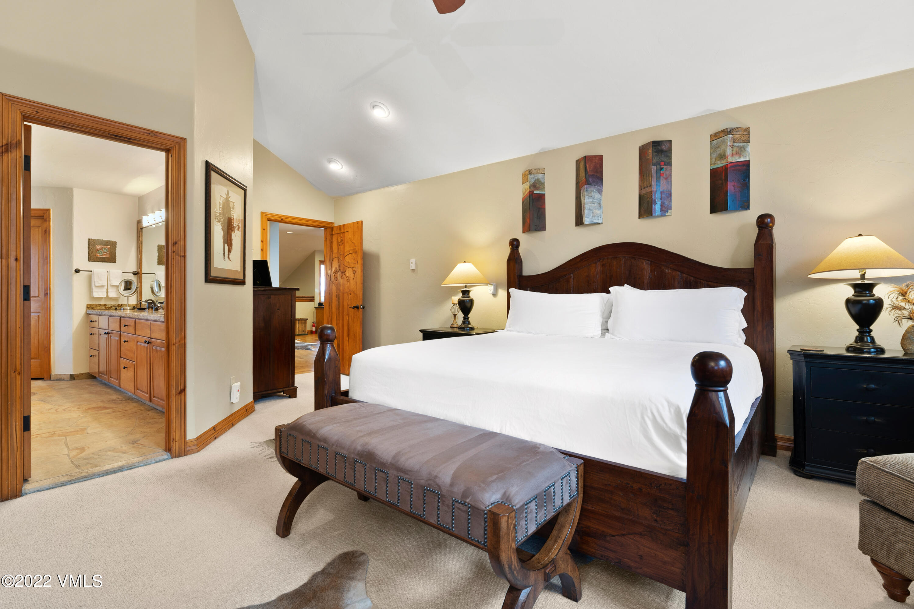 254 Arrowhead Drive, Unit B Edwards, CO 81632 - Photo 6 of 45 a bedroom with a bed and wooden floor