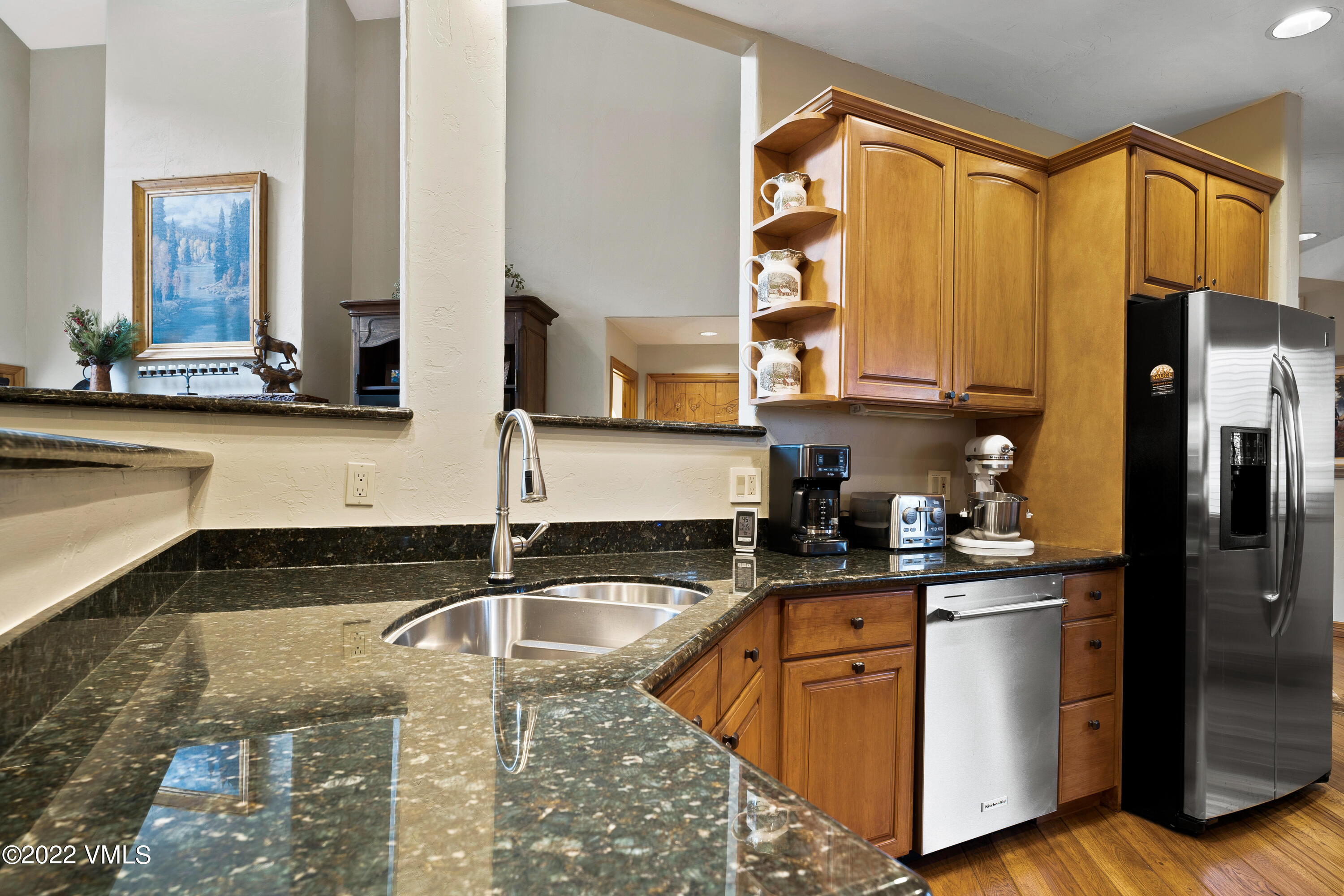 254 Arrowhead Drive, Unit B Edwards, CO 81632 - Photo 9 of 45 a kitchen with granite countertop a sink a counter top space cabinets and stainless steel appliances