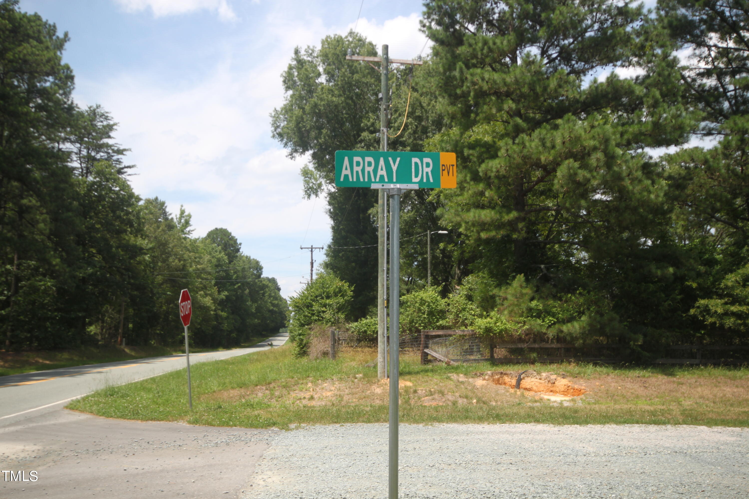 Lot 8 Array Drive Hillsborough, NC 27278 - Photo 2 of 12 a street sign on a sidewalk next to a road