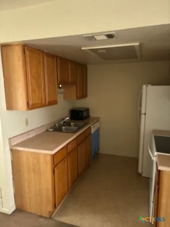 a utility room with washer and dryer
