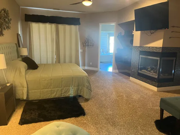 a bedroom with a bed and couch