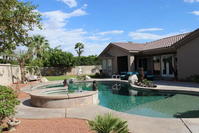 a view of a house with pool table and chairs