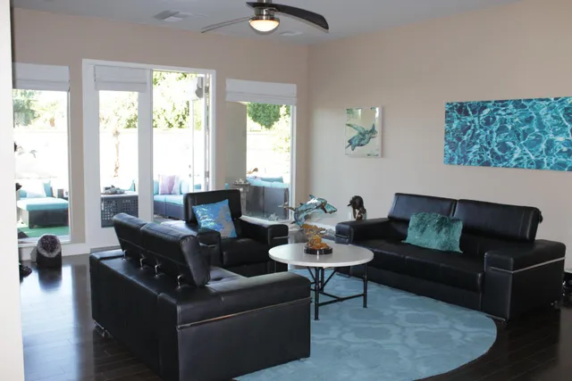 a room with dining table and chairs