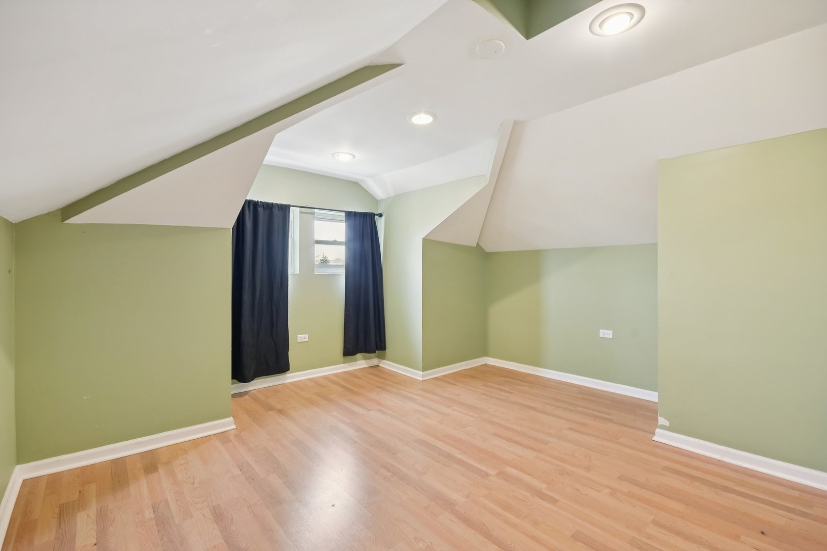 2928 North Rutherford Avenue Chicago, IL 60634 - Photo 11 of 25 a view of a big room with wooden floor and windows