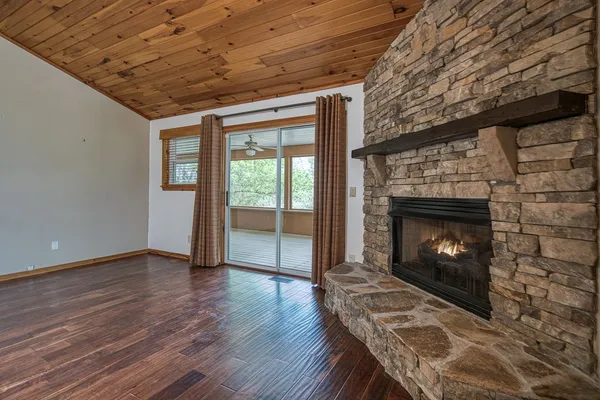 a view of livingroom with wooden floor and floor to ceiling window