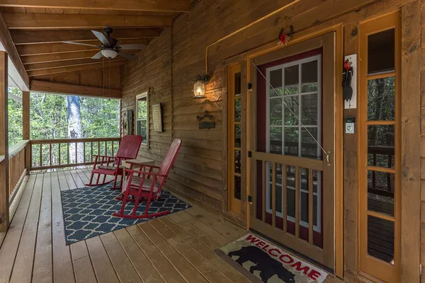 a view of porch with furniture and garden
