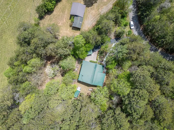 a view of house with backyard
