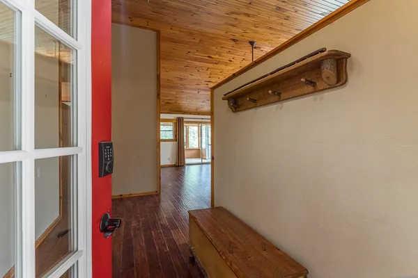 a kitchen with granite countertop wooden floors and fireplace