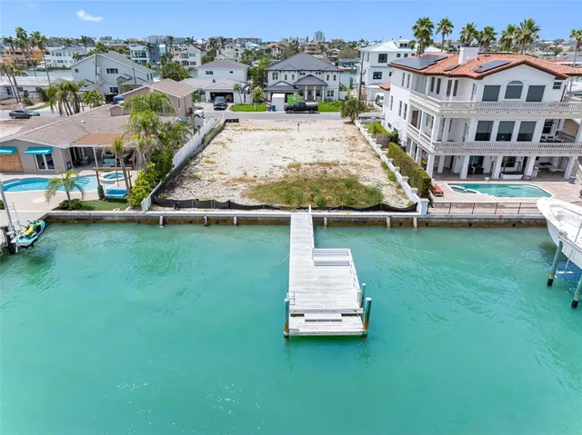 an aerial view of a house with swimming pool and view of a house