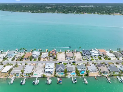 an aerial view of a house with a lake view