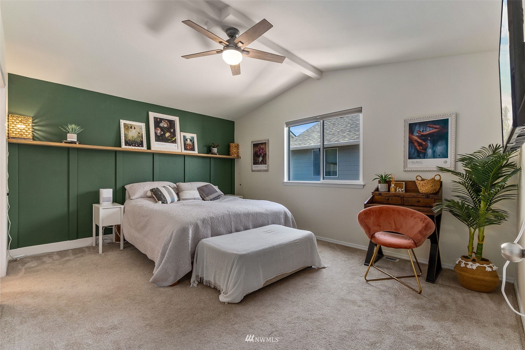 1016 186th Street Southeast Bothell, WA 98012 - Photo 17 of 26 a spacious bedroom with a bed and a chandelier