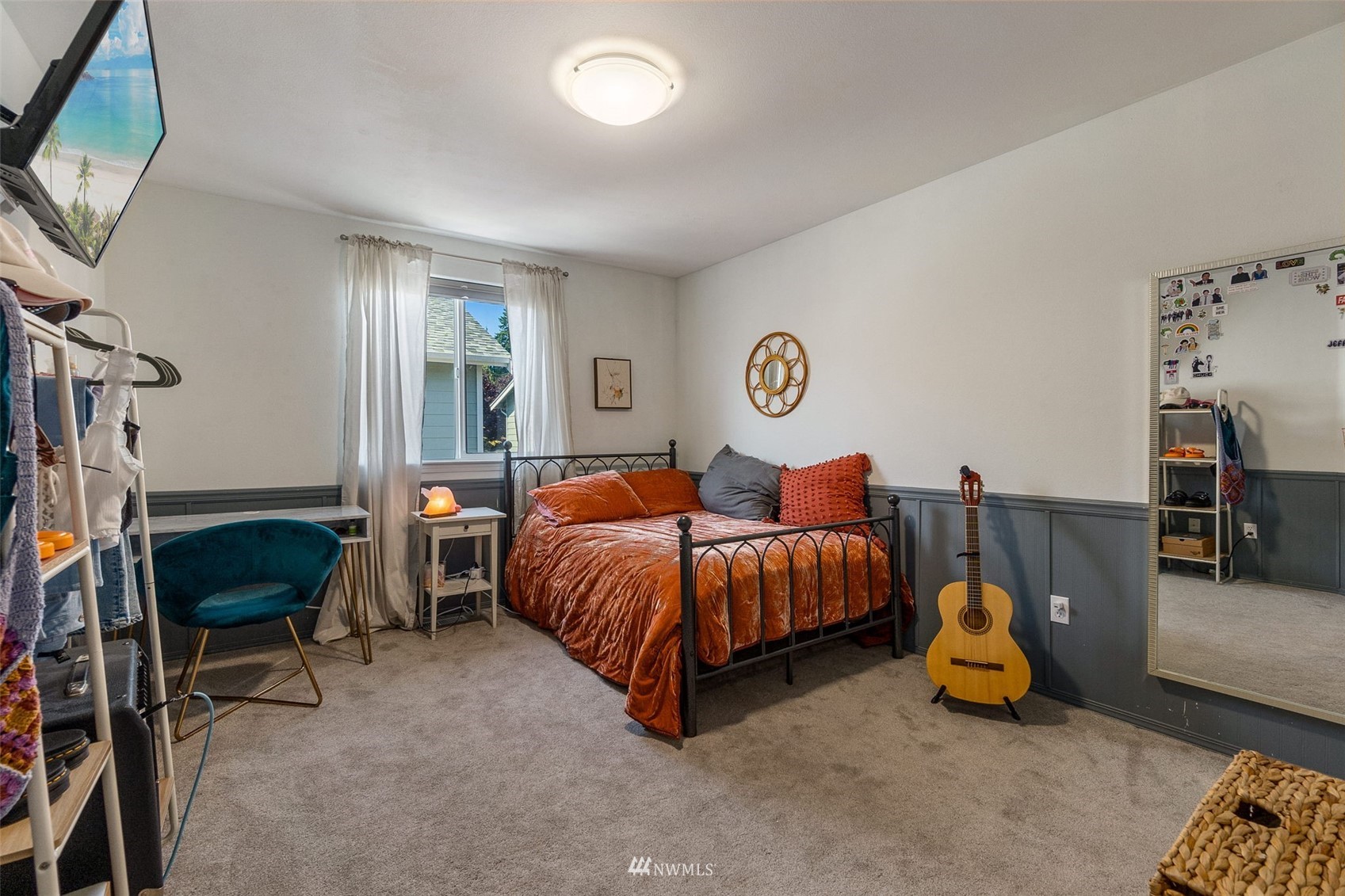 1016 186th Street Southeast Bothell, WA 98012 - Photo 21 of 26 a bedroom with bed and a chandelier