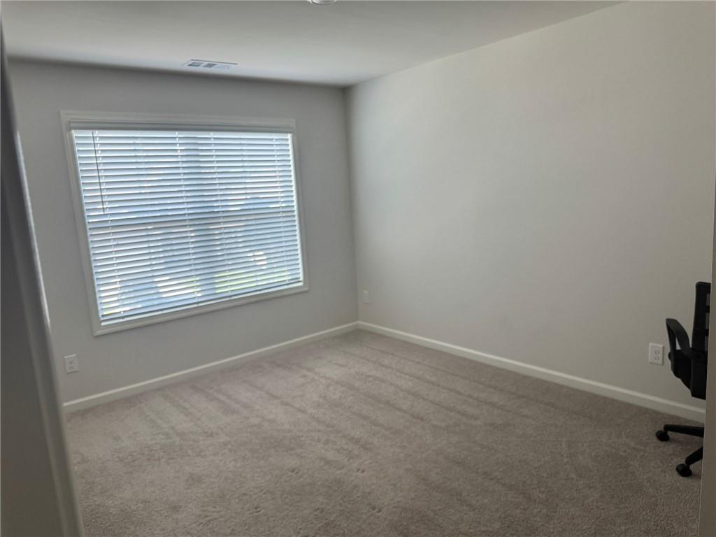 267 Citrine Way Acworth, GA 30101 - Photo 11 of 16 an empty room with a window