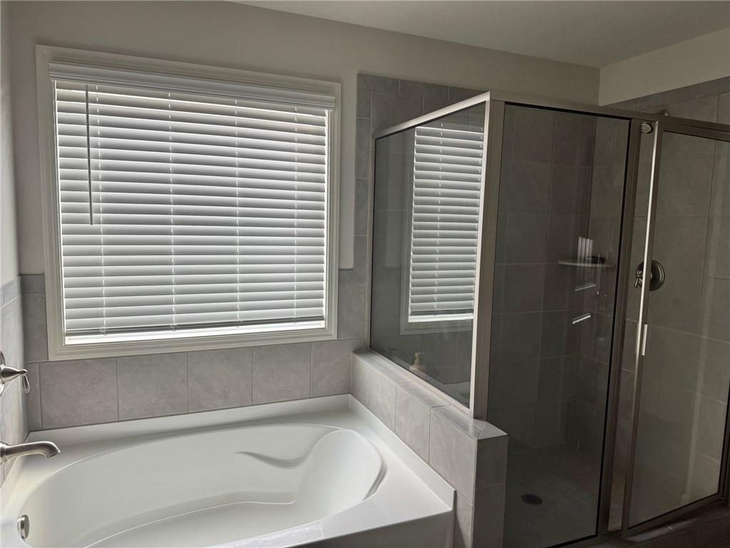 267 Citrine Way Acworth, GA 30101 - Photo 13 of 16 a bathroom with a bathtub and a window