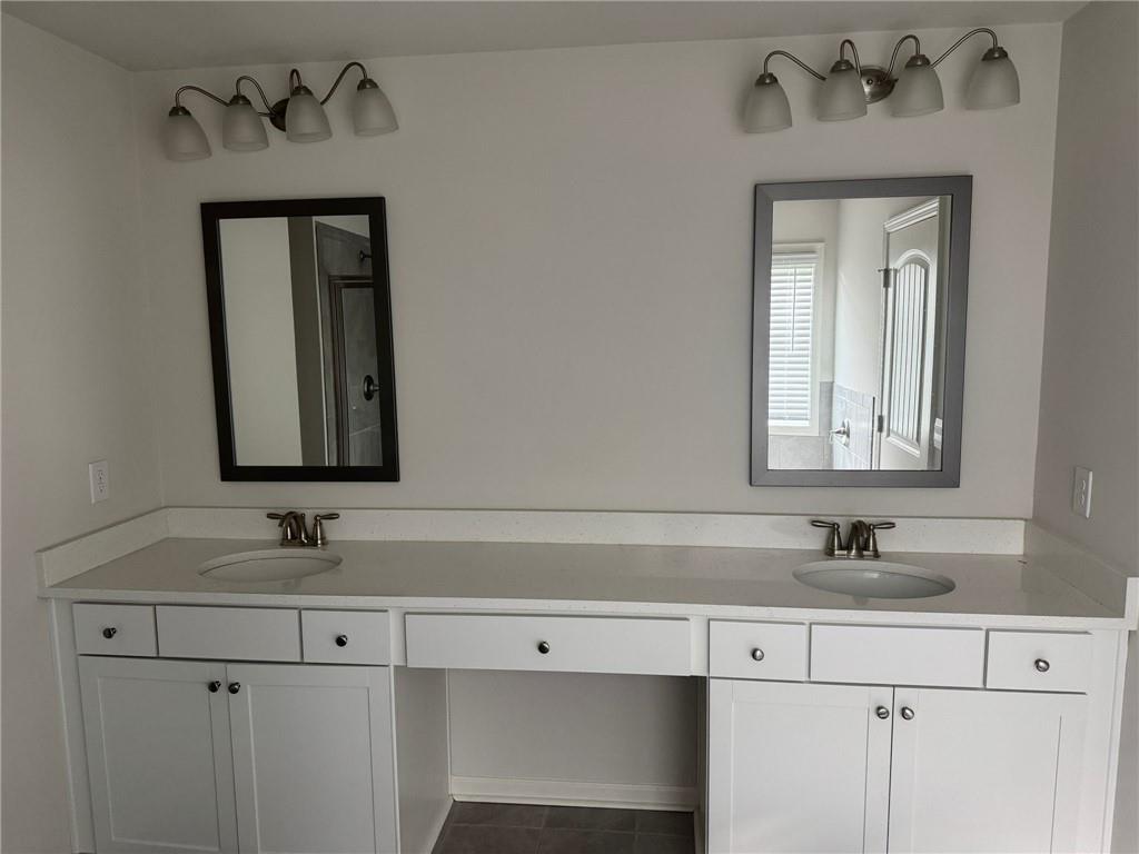 267 Citrine Way Acworth, GA 30101 - Photo 15 of 16 a sink with a mirror and vanity