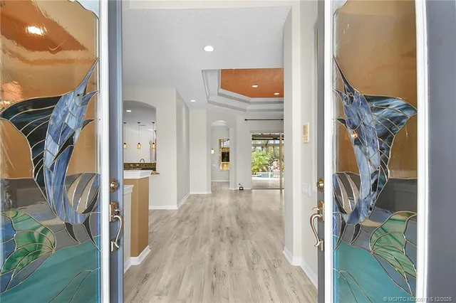 a view of an empty room with a fireplace and a window