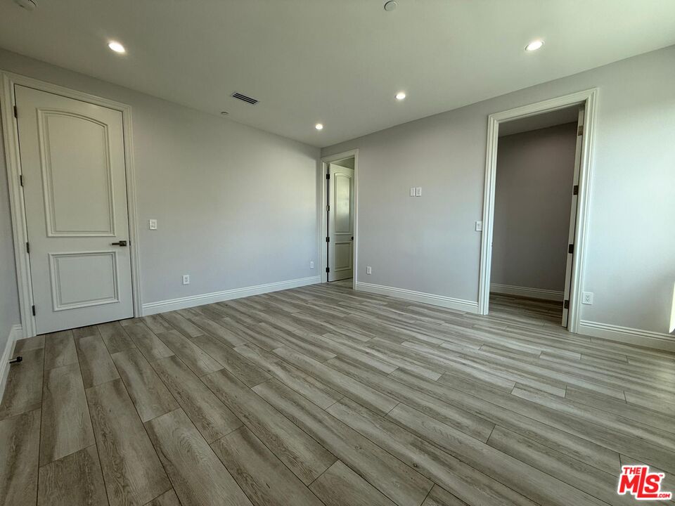 6717 Sunnyslope Avenue Van Nuys, CA 91401 - Photo 27 of 43 a view of empty room with wooden floor
