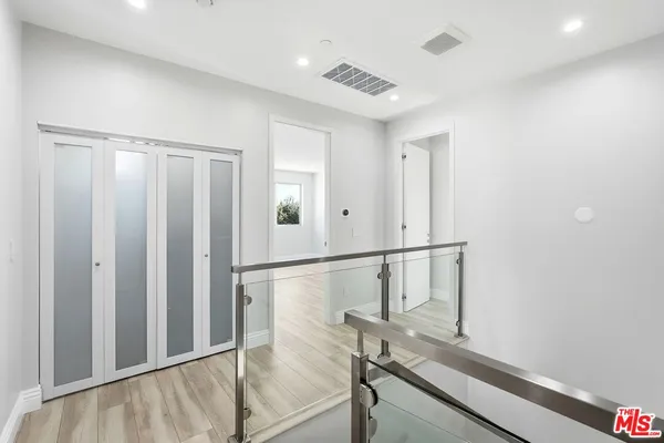 a view of entryway with wooden floor