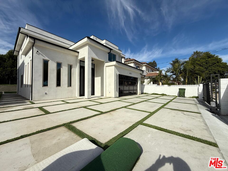 6717 Sunnyslope Avenue Van Nuys, CA 91401 - Photo 37 of 43 a view of a house with a balcony and door