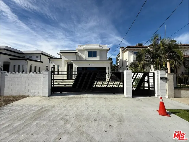 a view of a park with large trees