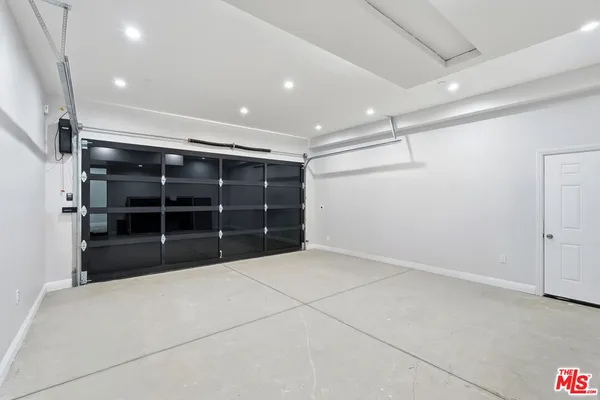 a view of an empty room with a cabinet