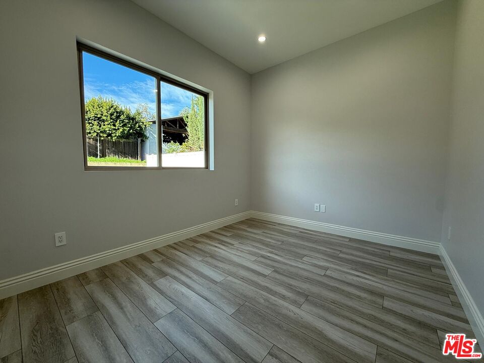6717 Sunnyslope Avenue Van Nuys, CA 91401 - Photo 7 of 43 an empty room with a window