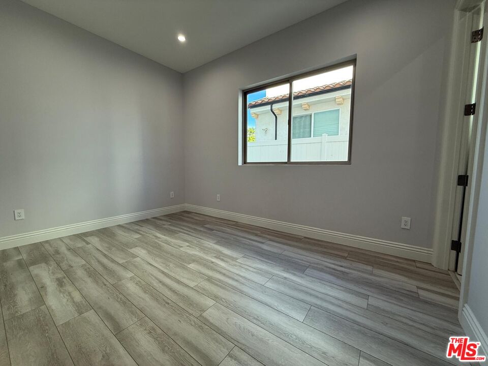 6717 Sunnyslope Avenue Van Nuys, CA 91401 - Photo 9 of 43 wooden floor in an empty room