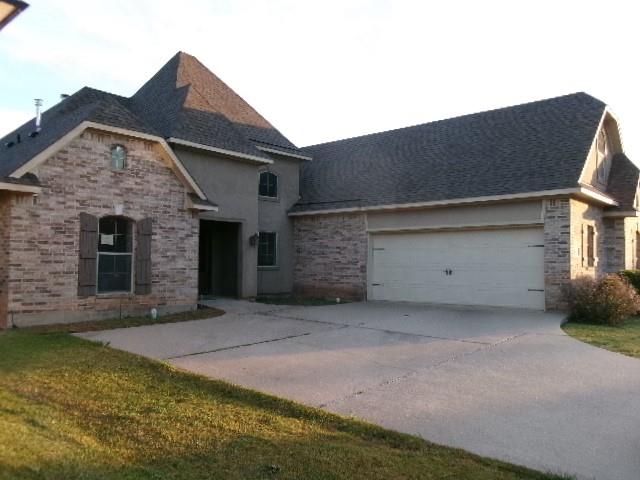 507 Falling Water Circle Bossier City, LA 71112 - Photo 2 of 15 a front view of a house with a garage