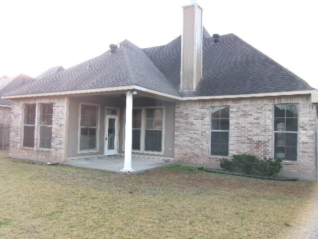 507 Falling Water Circle Bossier City, LA 71112 - Photo 3 of 15 a front view of a house with a garden