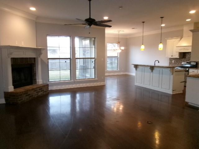 507 Falling Water Circle Bossier City, LA 71112 - Photo 4 of 15 a view of a kitchen with furniture and a floor to ceiling window