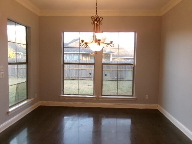 507 Falling Water Circle Bossier City, LA 71112 - Photo 6 of 15 a view of an empty room with wooden floor and a window