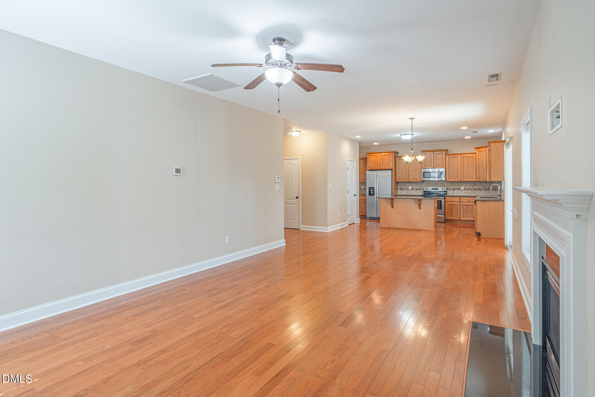 403 Rolling Pines Drive Spring Lake, NC 28390 - Photo 19 of 56 wooden floor in an empty room with a window