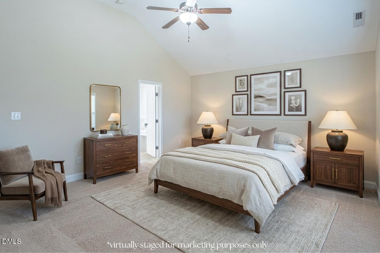 403 Rolling Pines Drive Spring Lake, NC 28390 - Photo 23 of 56 a bedroom with a bed and furniture