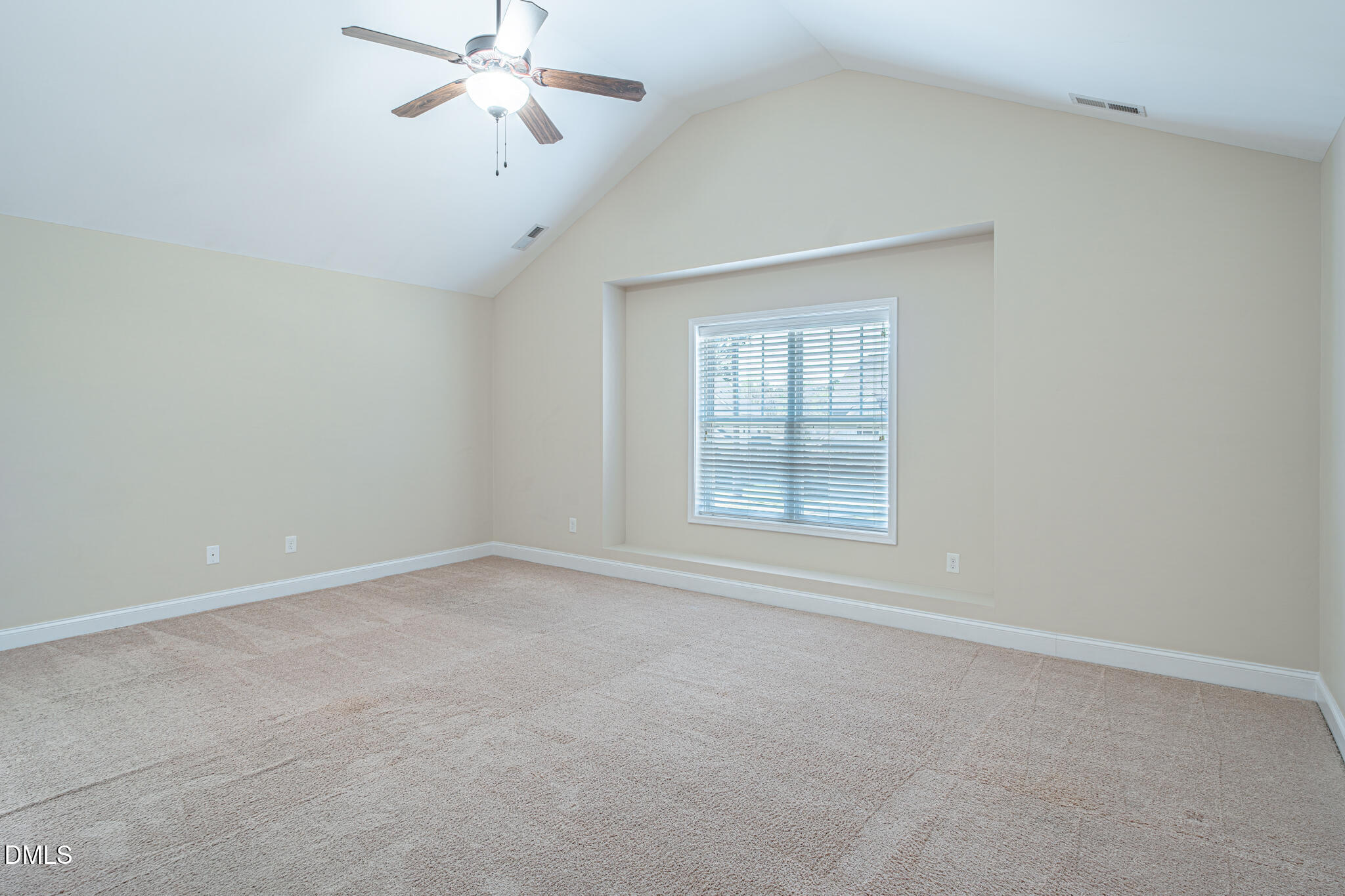 403 Rolling Pines Drive Spring Lake, NC 28390 - Photo 25 of 56 an empty room with chandelier fan and windows