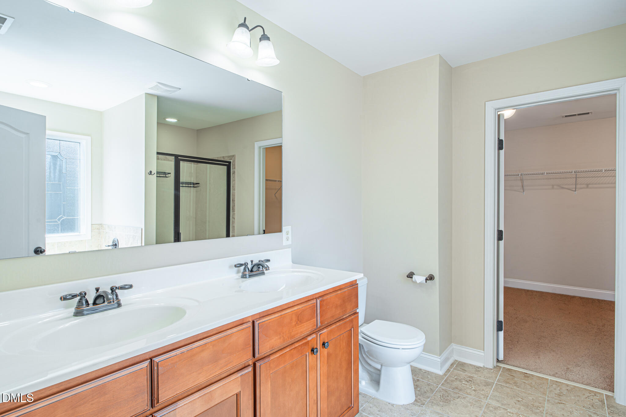 403 Rolling Pines Drive Spring Lake, NC 28390 - Photo 27 of 56 a bathroom with a sink a toilet and shower