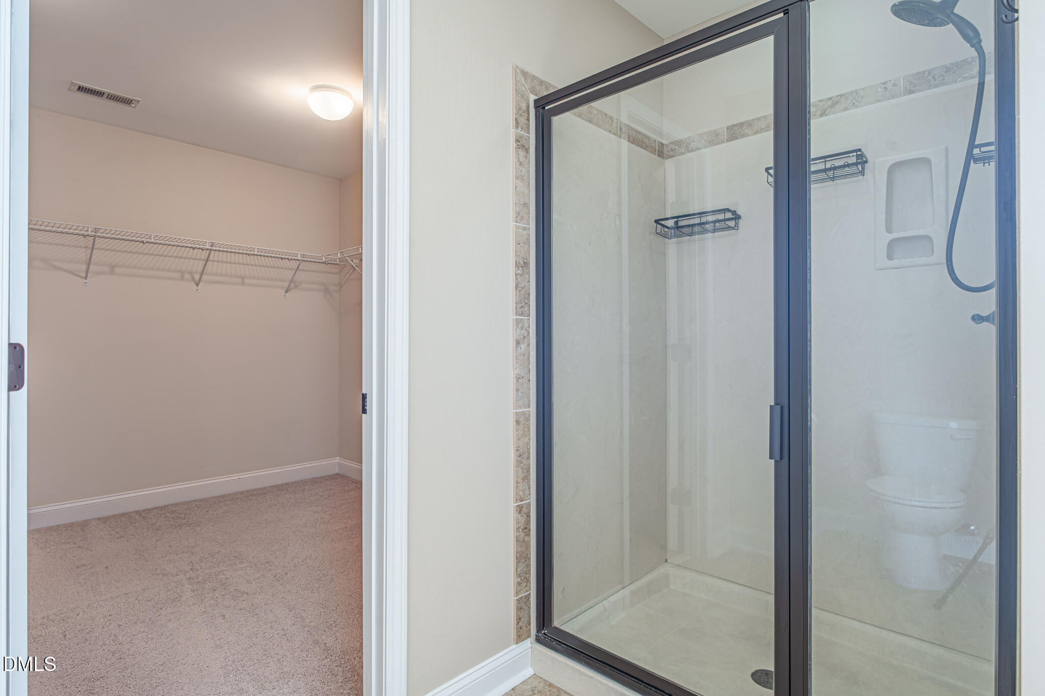 403 Rolling Pines Drive Spring Lake, NC 28390 - Photo 29 of 56 a bathroom with a glass shower door