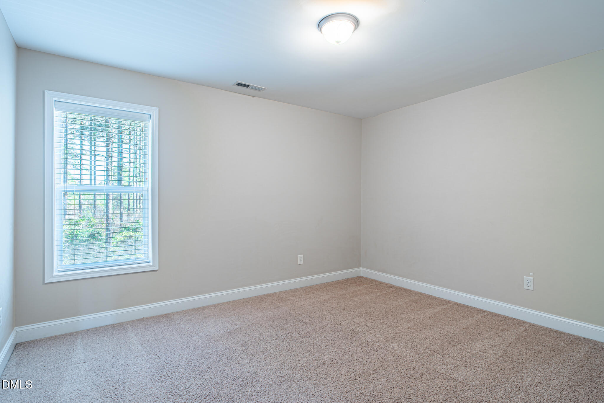 403 Rolling Pines Drive Spring Lake, NC 28390 - Photo 32 of 56 an empty room with a window