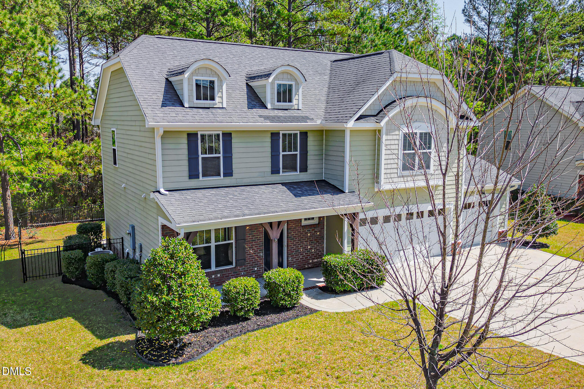 403 Rolling Pines Drive Spring Lake, NC 28390 - Photo 4 of 56 a front view of a house with garden